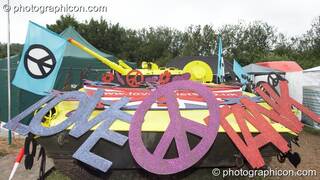 The Love Tank, a yellow army tank decorated with CND peace symbols in the Shangri-La field at Glastonbury Festival 2008. Pilton, Great Britain. © 2008 Photographicon