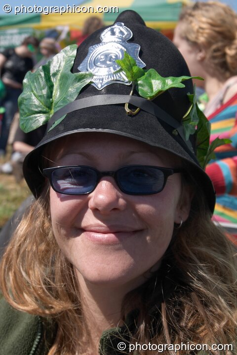 Woman Green Police officer wearing a decorated helmet at Glastonbury Festival 2004. Pilton, Great Britain. © 2004 Photographicon