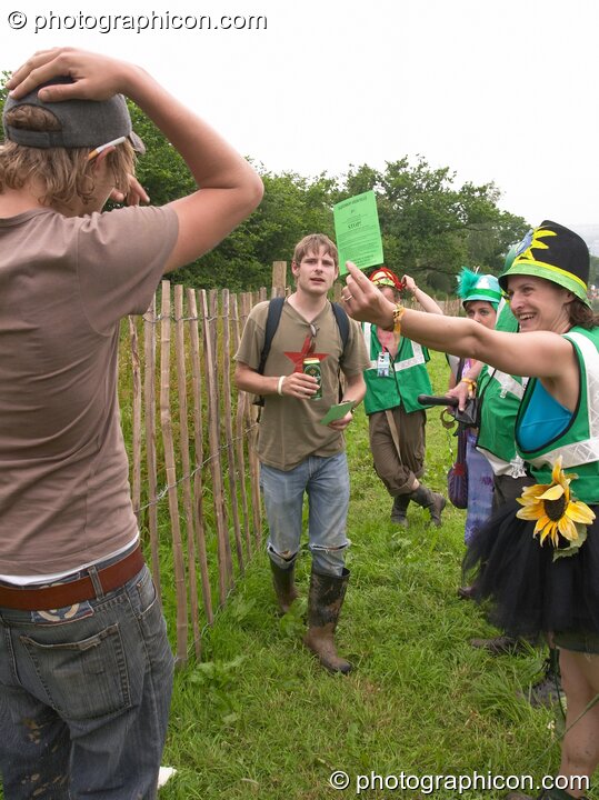 The Green Police make an arrest for pissing in King's Meadow at Glastonbury Festival 2005. Pilton, Great Britain. © 2005 Photographicon