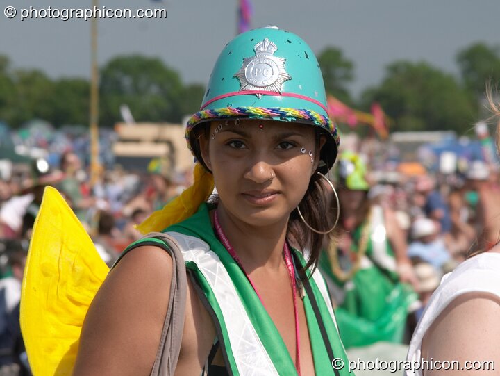 Woman Green Police officer wearing angel wings at Glastonbury Festival 2005. Pilton, Great Britain. © 2005 Photographicon