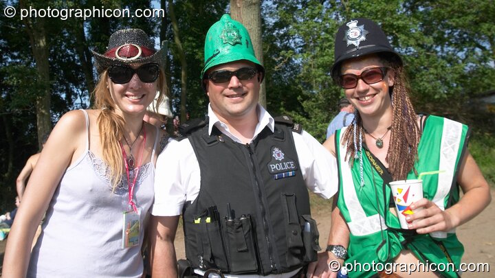 As a mark of respect, Somerset Constabulary swap helmets with the Green Police at Glastonbury Festival 2005. Pilton, Great Britain. © 2005 Photographicon