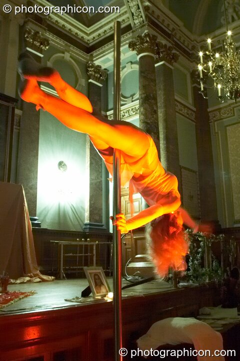 Ingrid Fluorotrash performs sensuous pole dancing at London Festival of Tantra 2009. Great Britain. © 2009 Photographicon