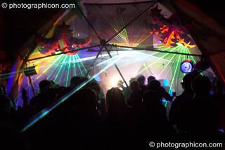 Lasers, decor, and dancers inside the Main Stage dome at Planet Bob's Offworld Festival 2007. Swindon, Great Britain. © 2007 Photographicon