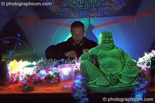 Moonquake (Nico Pianet - Hadra/Chrysalid, France/UK) DJs with a plastic Buddha on the Main Stage at Planet Bob's Offworld Festival 2007. Swindon, Great Britain. © 2007 Photographicon