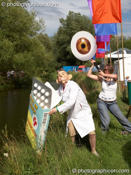 A campaigning group dressed in a giant eye draw attention to the politics of HIV medicine at the Secret Garden Party 2006. Huntingdon, Great Britain. © 2006 Photographicon