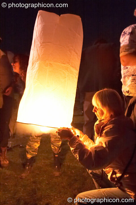 A small paper hot-air balloon is launched at the Secret Garden Party 2006. Huntingdon, Great Britain. © 2006 Photographicon