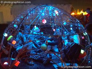 People chilling in a small dome structure at the Secret Garden Party 2006. Huntingdon, Great Britain. © 2006 Photographicon