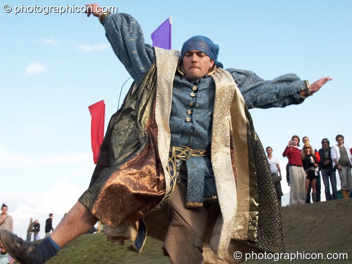 A man in costume takes a tumble during the dangerous sports skating challenge at the Secret Garden Party 2006. Huntingdon, Great Britain. © 2006 Photographicon