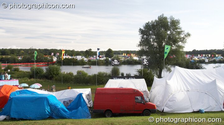 A view of the lake behind some marquees at the Secret Garden Party 2007. Huntingdon, Great Britain. © 2007 Photographicon