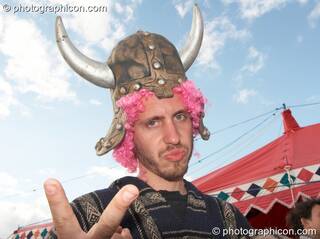 A man wearing a Viking helmet at the Secret Garden Party 2007. Huntingdon, Great Britain. © 2007 Photographicon