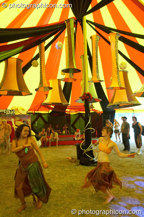 People dancing in the Fish Seeks Bicycle tent at the Secret Garden Party 2008. Huntingdon, Great Britain. © 2008 Photographicon
