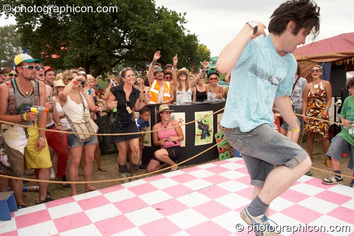 A dance-off competition watched by a group of wonky people at the Secret Garden Party 2008. Huntingdon, Great Britain. © 2008 Photographicon