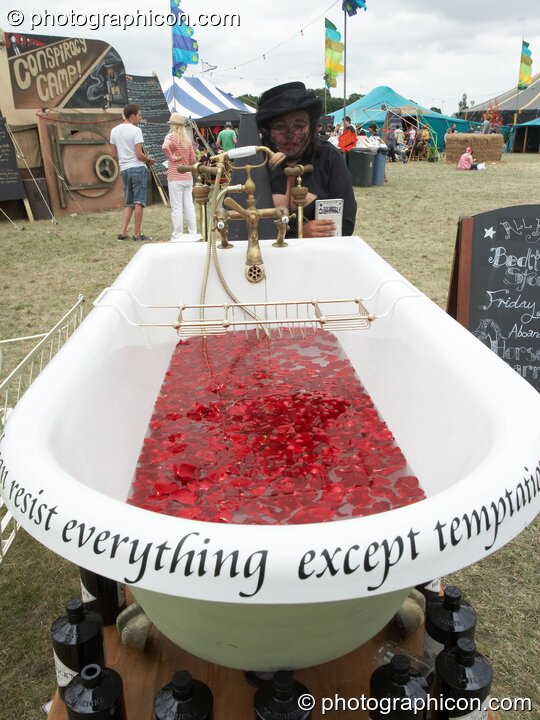 A bath filled with coctail drink at the Secret Garden Party 2010. Huntingdon, Great Britain. © 2010 Photographicon