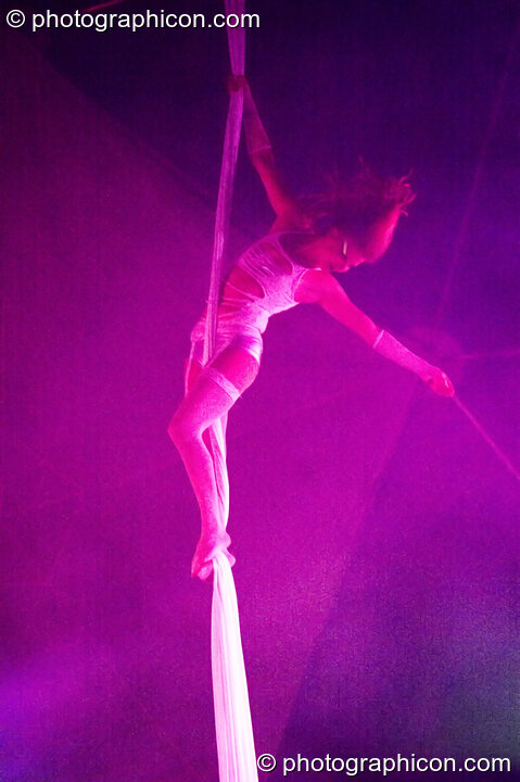 Claire O'Neill performs aerial silk acrobatics in the Remix Tent at the Secret Garden Party 2010. Huntingdon, Great Britain. © 2010 Photographicon