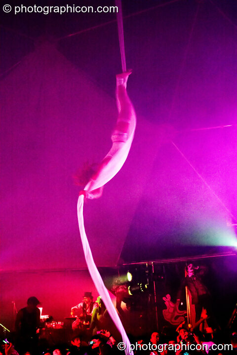 Claire O'Neill performs aerial silk acrobatics in the Remix Tent at the Secret Garden Party 2010. Huntingdon, Great Britain. © 2010 Photographicon