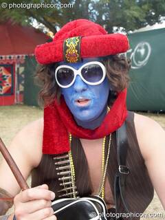 A man with blue painted face at the Secret Garden Party 2010. Huntingdon, Great Britain. © 2010 Photographicon
