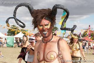 A man with tribal ram's horns at the Secret Garden Party 2010. Huntingdon, Great Britain. © 2010 Photographicon