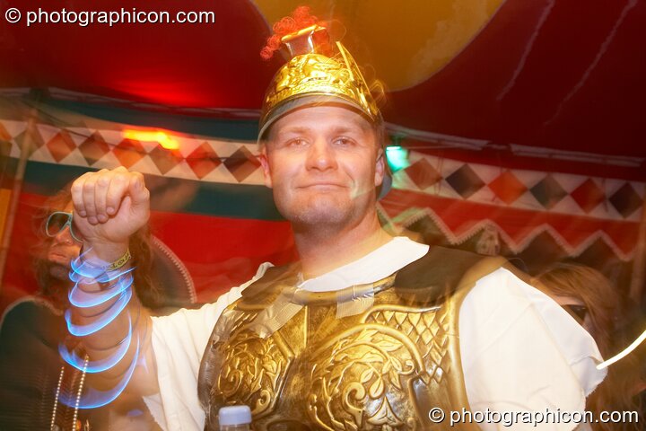 A man in a wonky Gladiator costume dances in the Lizard tent at the Secret Garden Party 2010. Huntingdon, Great Britain. © 2010 Photographicon