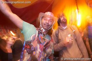 A man in a wonky costume dances in the Lizard tent at the Secret Garden Party 2010. Huntingdon, Great Britain. © 2010 Photographicon