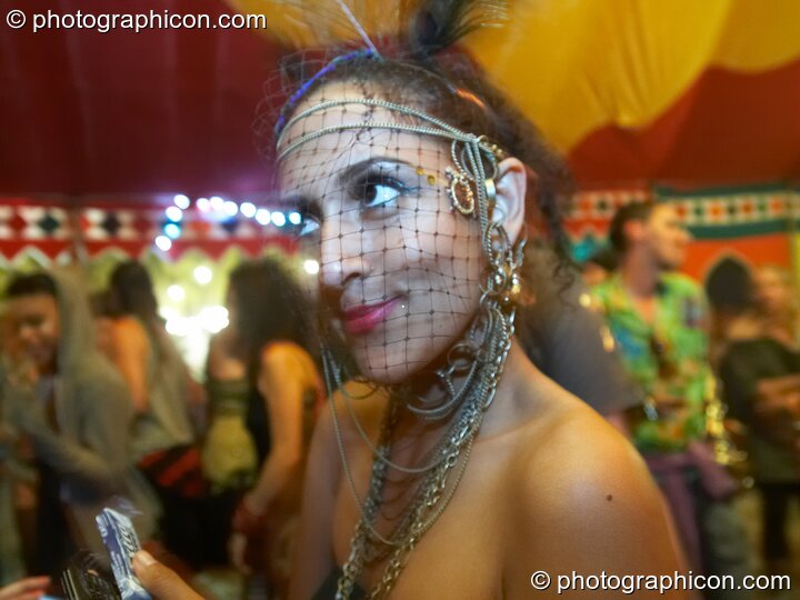 A woman in wonky costume dances in the Lizard tent at the Secret Garden Party 2010. Huntingdon, Great Britain. © 2010 Photographicon