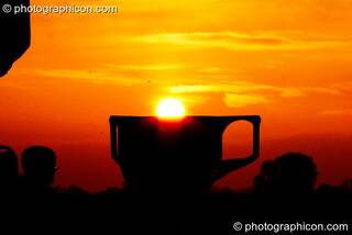 The sun rises over a giant chalice at Sunrise Celebration 2007. Yeovil, Great Britain. © 2007 Photographicon