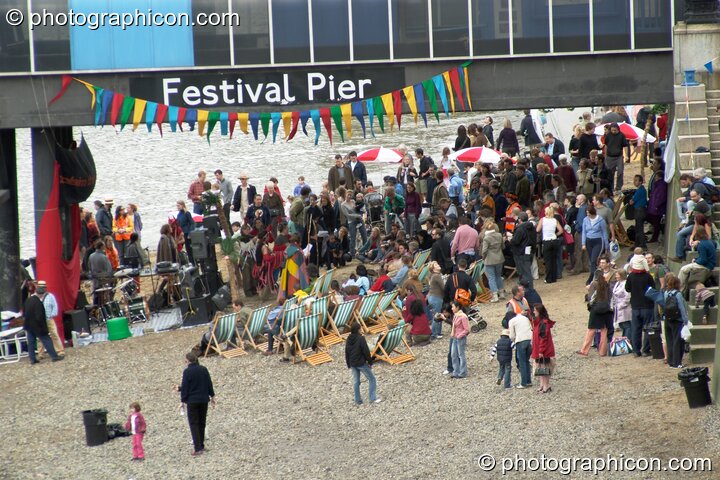 A Reclaim The Beach party on the sandy river bank at the Thames Festival 2004. London, Great Britain. © 2004 Photographicon