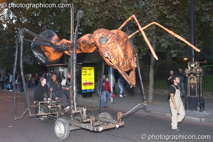 The cycle-powered insectoid creations of Sarruga gather for the night carnival at the Thames Festival 2004. London, Great Britain. © 2004 Photographicon