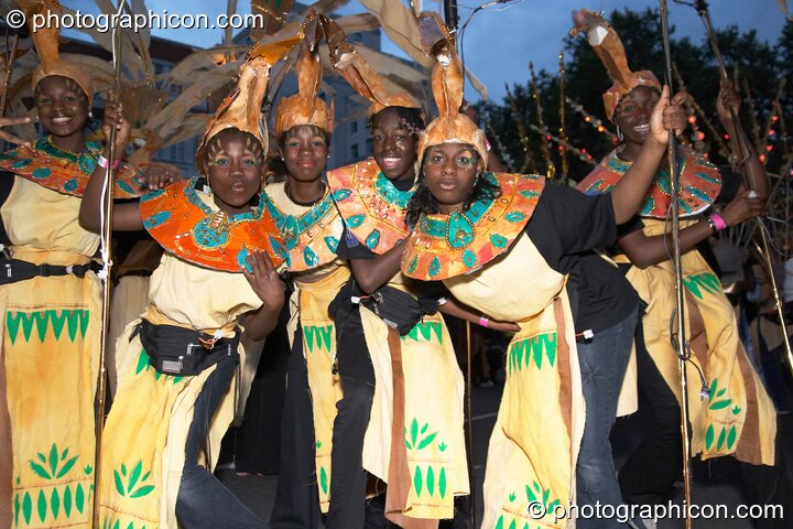 Group of female African dancers pose in the night carnival at the Thames Festival 2004. London, Great Britain. © 2004 Photographicon