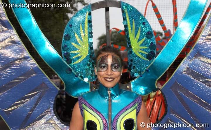 Close-up of woman in colourful costume participates in the carnival at the Thames Festival 2005. London, Great Britain. © 2005 Photographicon