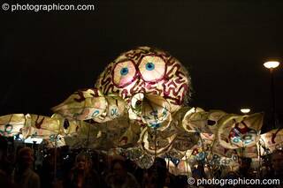 Giant stylised carnival octopus carried at night by children hidden in the shadows at the Thames Festival 2005. London, Great Britain. © 2005 Photographicon