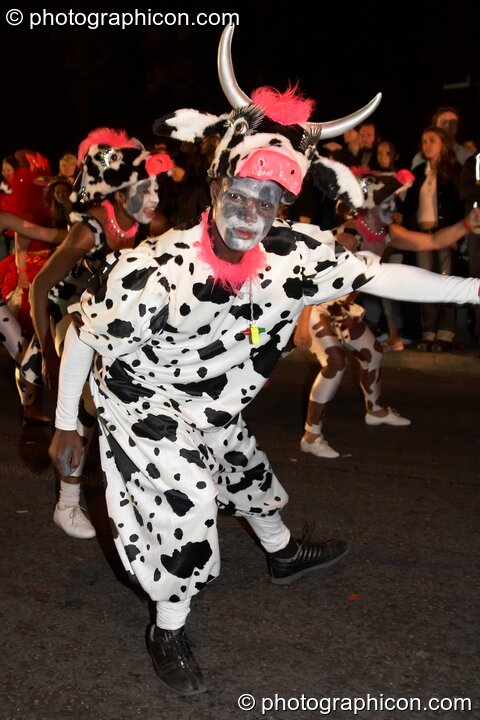 Man dances in a cow costume during the carnival at the Thames Festival 2005. London, Great Britain. © 2005 Photographicon