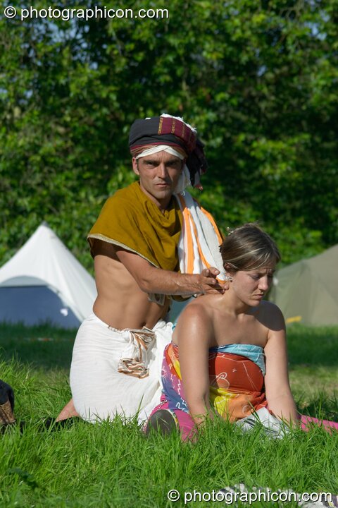 A man administering a touch of healing massage at the Turaya Gathering 2004. Wimborne, Great Britain. © 2004 Photographicon