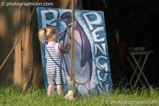 A little girl plays outside the Purple Penguin Cafe Turaya Gathering 2004. Wimborne, Great Britain. © 2004 Photographicon