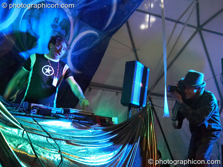 Gaudi (Interchill Records) DJs on the Gaia Chill stage while Matthew Cameron-Wilton takes photos at Waveform Project 2007. Kenton, Exeter, Great Britain. © 2007 Photographicon