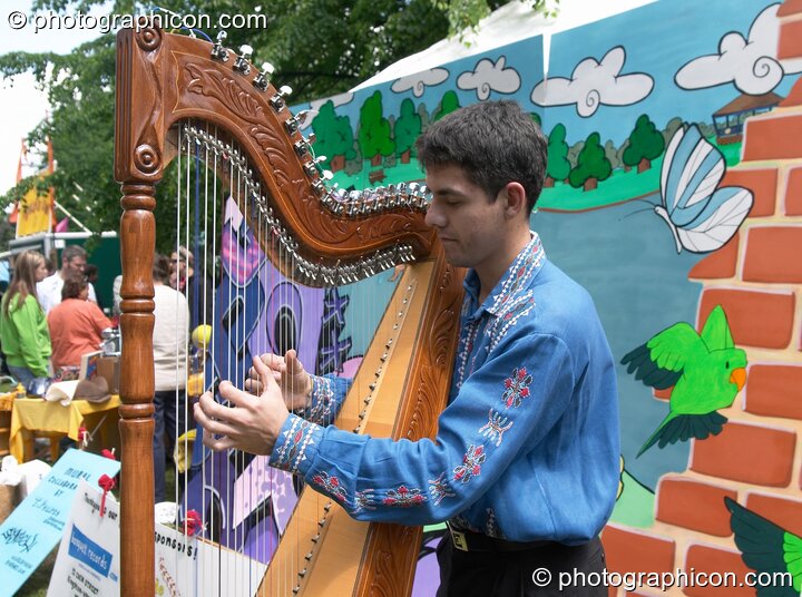 Kike the harpist at Kingston Green Fair 2005. Kingston Upon Thames, Great Britain. © 2005 Photographicon