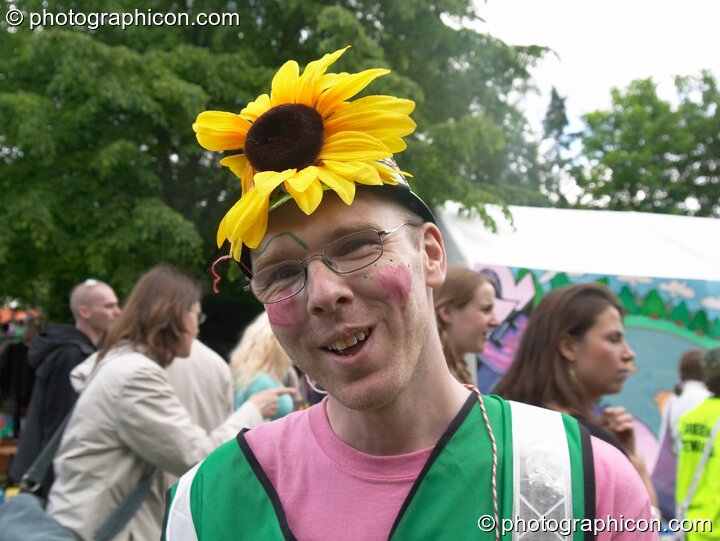 Green Police man with sunflower helmet at Kingston Green Fair 2005. Kingston Upon Thames, Great Britain. © 2005 Photographicon