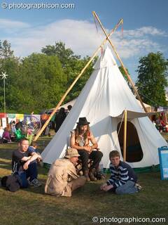 People sittng by a Tipi in the Healing Area at Kingston Green Fair 2005. Kingston Upon Thames, Great Britain. © 2005 Photographicon
