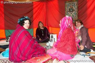 A group of women sit in quiet contemplation inside the Goddess Temple at Kingston Green Fair 2007. Kingston upon Thames, Great Britain. © 2007 Photographicon