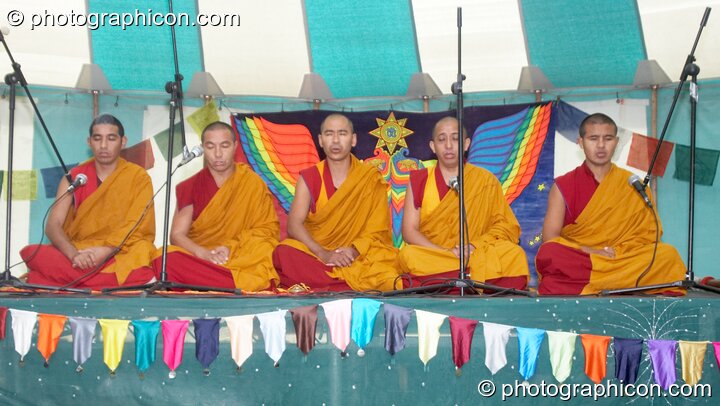 Tibetan monks of Tashi-Lhumpo perform a chant in the Sacred Dance tent at Kingston Green Fair 2007. Kingston upon Thames, Great Britain. © 2007 Photographicon