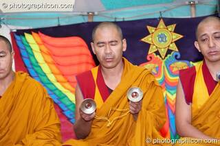 Tibetan monks of Tashi-Lhumpo perform a chant in the Sacred Dance tent at Kingston Green Fair 2007. Kingston upon Thames, Great Britain. © 2007 Photographicon