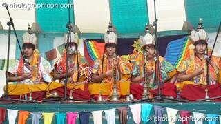 Tibetan monks of Tashi-Lhumpo perform a ritual chant in the Sacred Dance tent at Kingston Green Fair 2007. Kingston upon Thames, Great Britain. © 2007 Photographicon