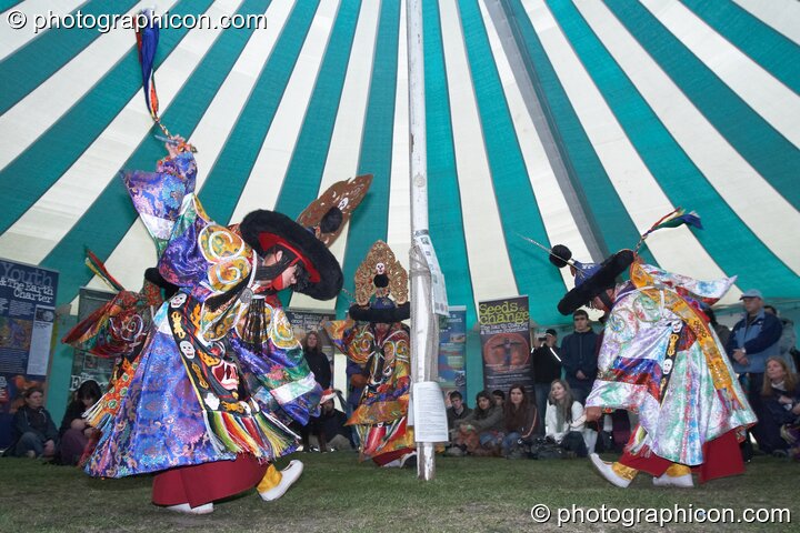 Tibetan monks of Tashi-Lhumpo perform a ritual costumed dance in the Sacred Dance tent at Kingston Green Fair 2007. Kingston upon Thames, Great Britain. © 2007 Photographicon