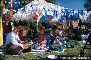 People chilling on shaded grass at Kingston Green Fair 1997. Kingston upon Thames, Great Britain. © 1997 Photographicon