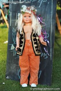 A Barbie doll dressed in hippie clothes at Kingston Green Fair 2002. Kingston upon Thames, Great Britain. © 2002 Photographicon