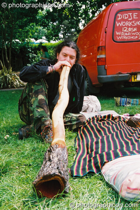 A man playing a didj at Kingston Green Fair 2003. Kingston upon Thames, Great Britain. © 2003 Photographicon