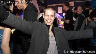 Man with open arms at theTwisted Records Label Party. London, Great Britain. © 2006 Photographicon