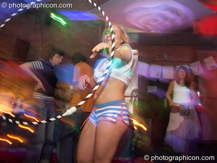 Woman dancing with a hula hoop at Echo System. London, Great Britain. © 2006 Photographicon