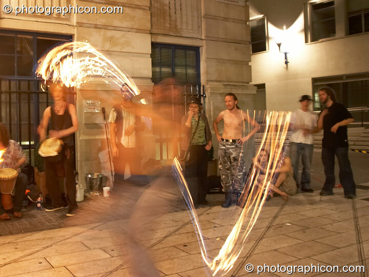 A fire-sabre performance by Jedi Jugglers outside the Kalahari party. London, Great Britain. © 2006 Photographicon