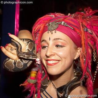 Kwalilox dances with her snake, Khan, at the Kalahari party. London, Great Britain. © 2006 Photographicon