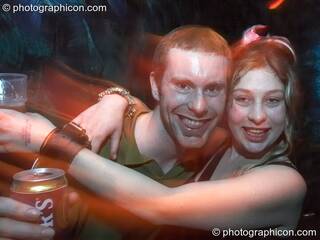 Two friends link arms at the Liquid Records party. London, Great Britain. © 2007 Photographicon